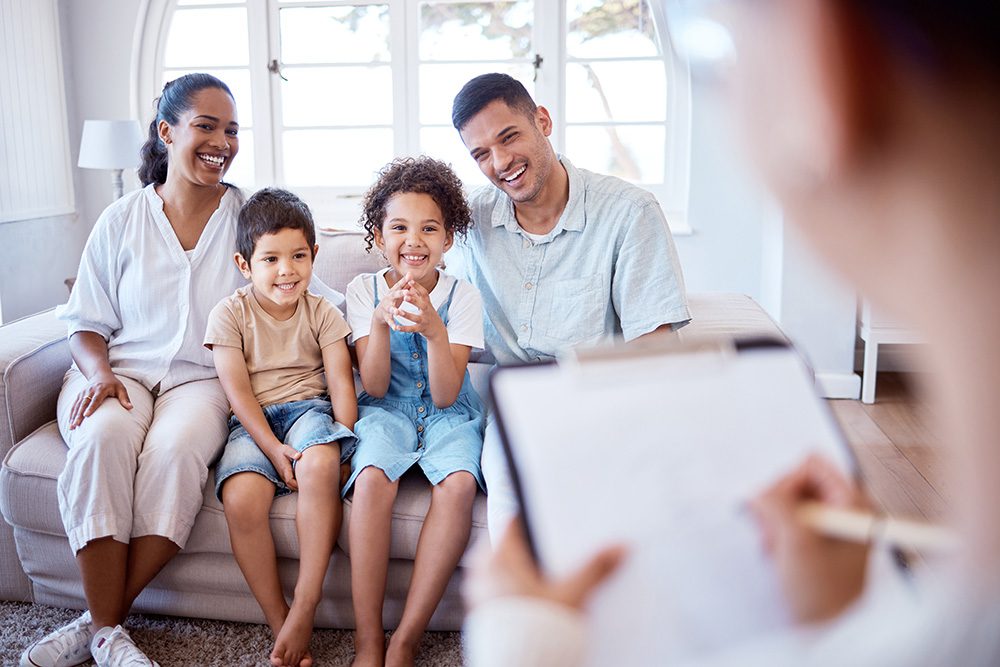 A happy family in a therapy session.